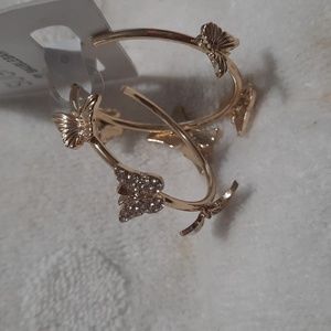 Gold tone hoop w butterfly design